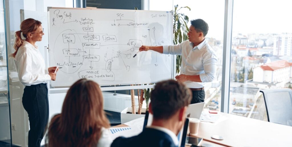 Asian man and woman holding a meeting